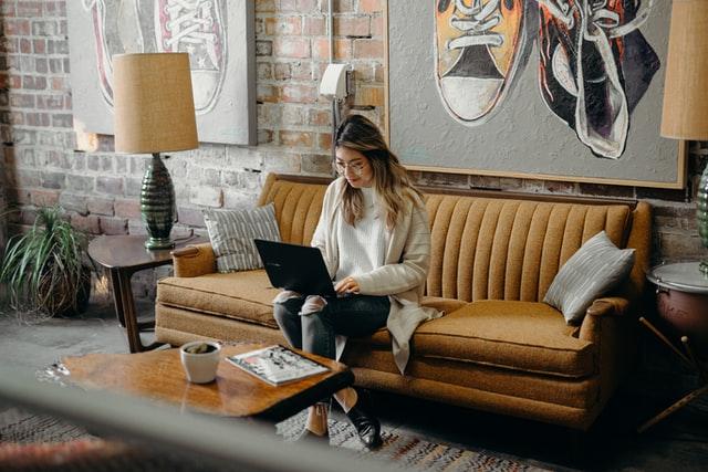 woman working by the couch - Email Open Rates