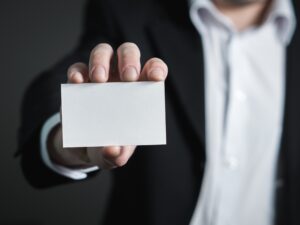 Person holding a card for display during email marketing campaign