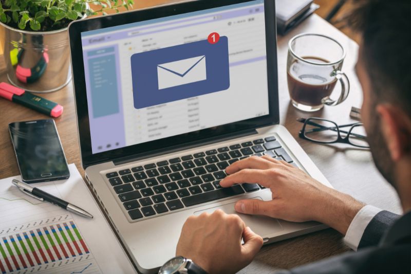 Man working on a laptop, he has received an email