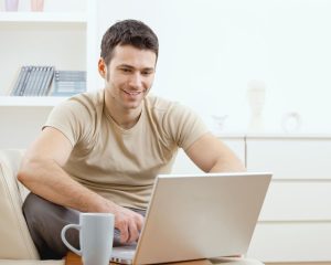 man looking at his laptop - SendGrid Emails Going to Spam