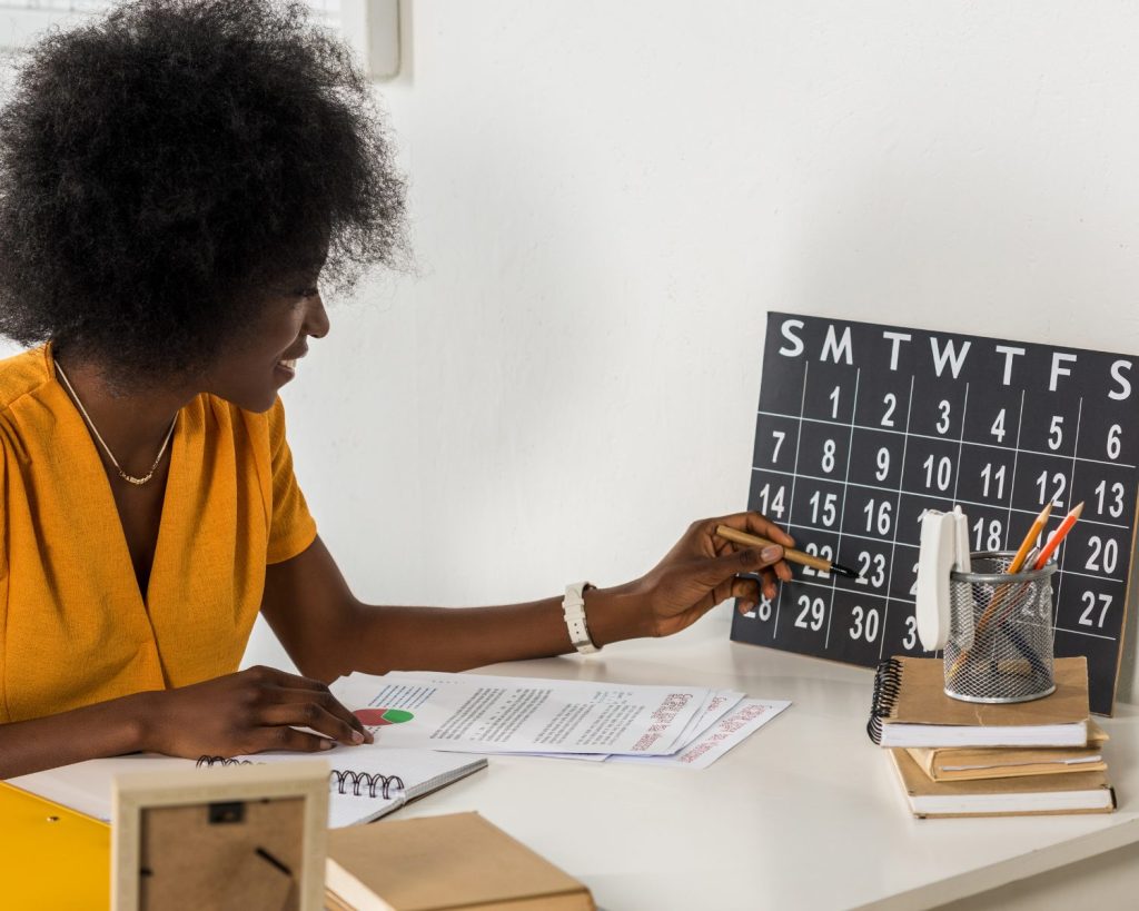 Marketing manager selecting a date on a calendar