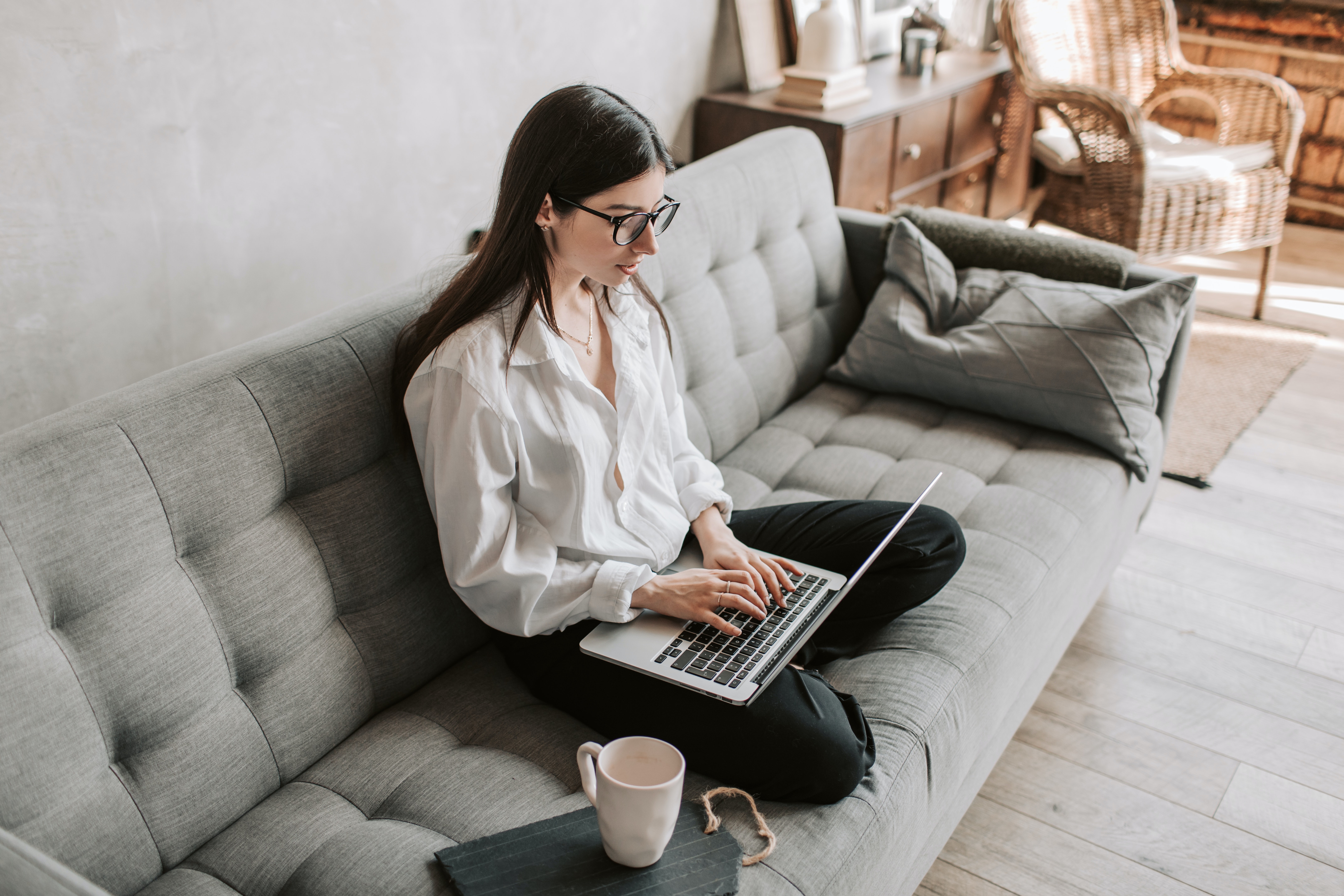woman working on couch