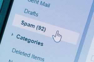 A cell phone screen displaying spam emails.