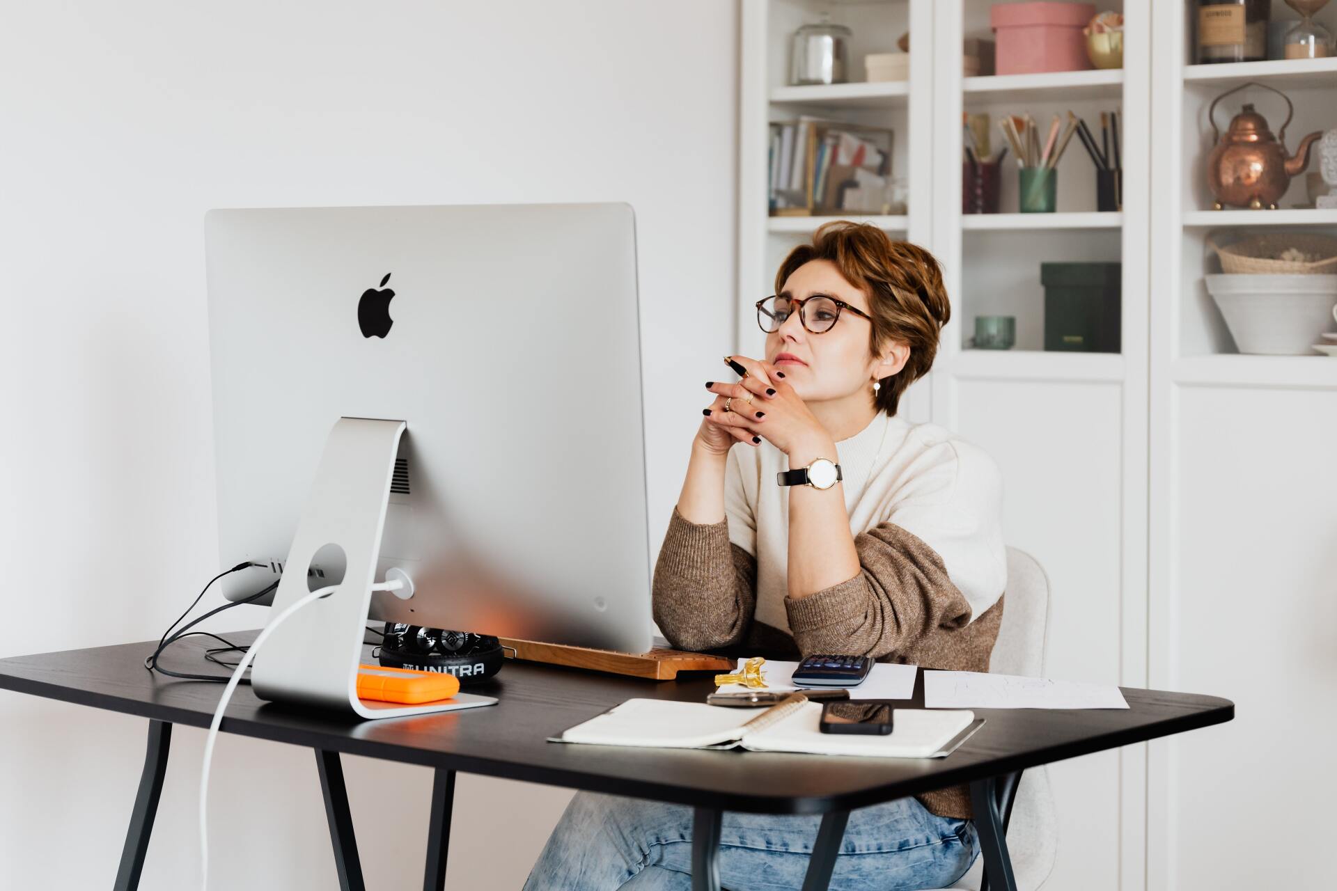 woman thinking at desk