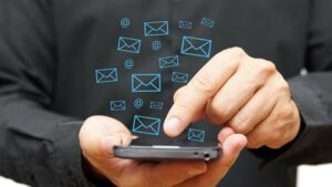 mail icons coming out from a phone - bulk email legal requirements