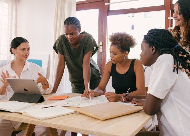 group of black women at a table - What is IP Blacklisting