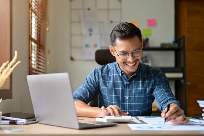 man reviewing notes on a desk - Cold Email CPA Firms