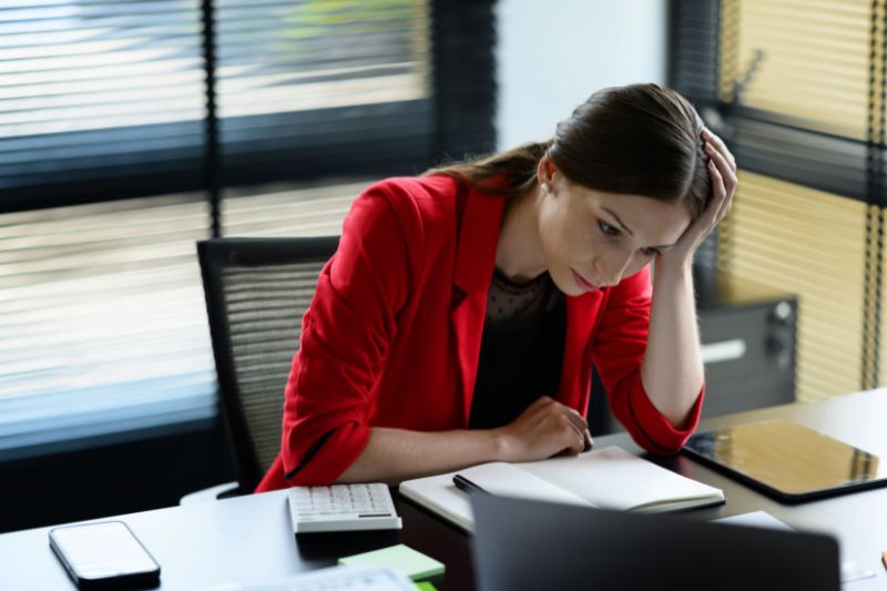 female accountant in a red blazer working