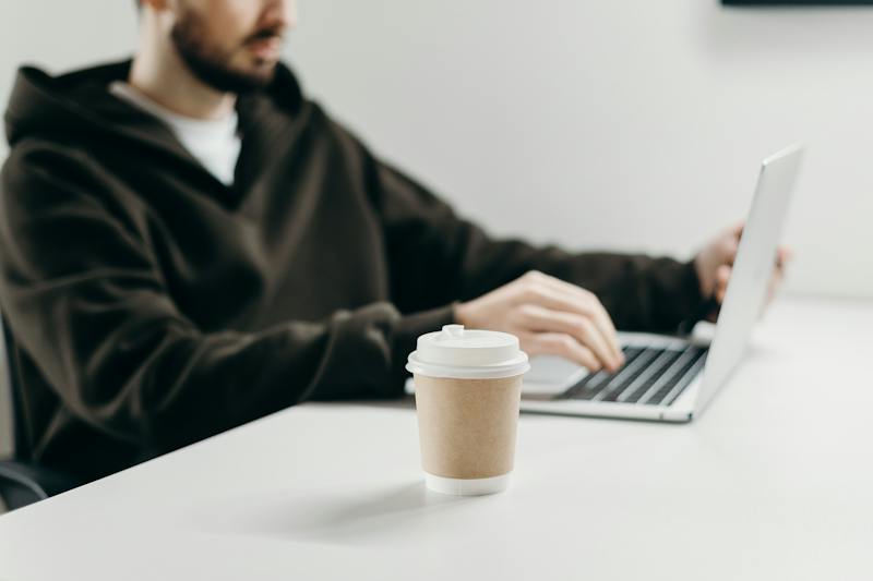 Man working on his laptop starting an email campaign