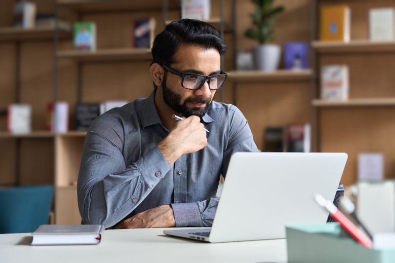 person reviewing information on a computer, relevant to implementing DMARC reject policies 