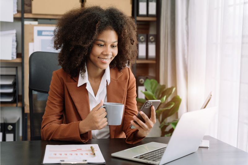 Woman smiling while browsing her phone exploring alternatives to PTR