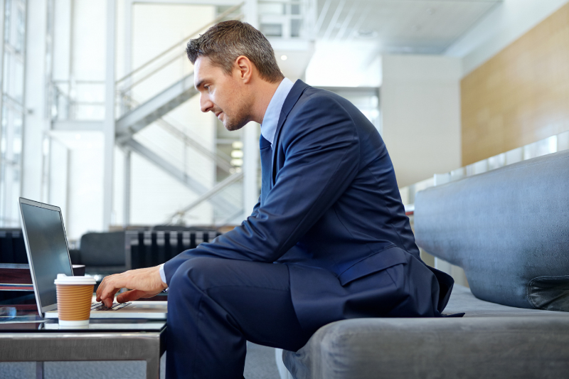 A businessman planning email campaign on his laptop 