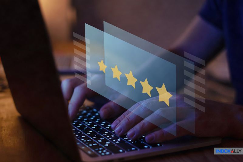 Hands typing on a laptop with a five-star rating overlay, symbolizing reliable SMTP relay services for optimal email performance
