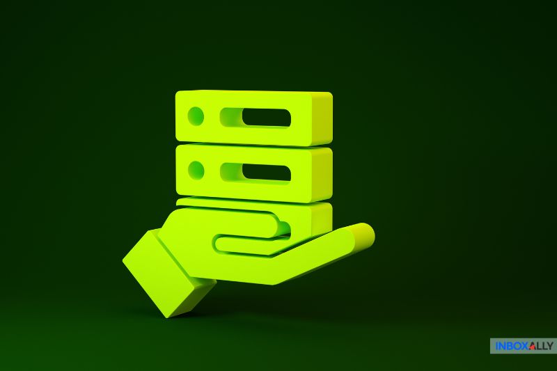 A 3D graphic of a lime green hand holding three horizontally stacked lime green objects on a dark green background, reminiscent of the precision and care involved in managing an effective email spam filter.