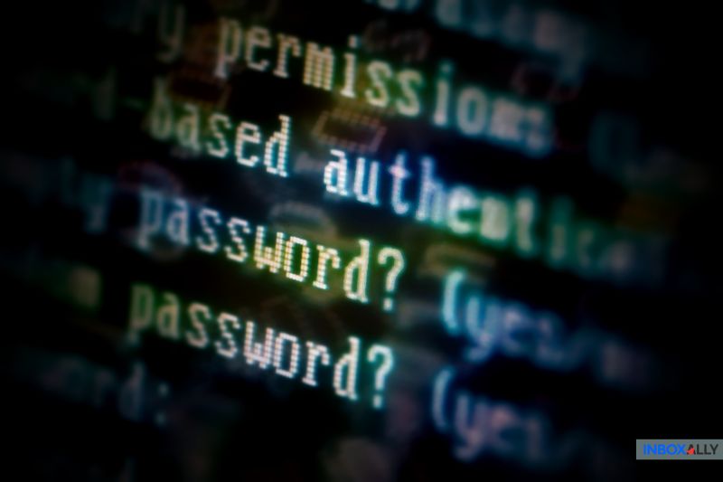 Blurred close-up image of a computer screen displaying lines of code with the words "password?" highlighted, leaving one worried about the absence of a DMARC record to enhance email security.