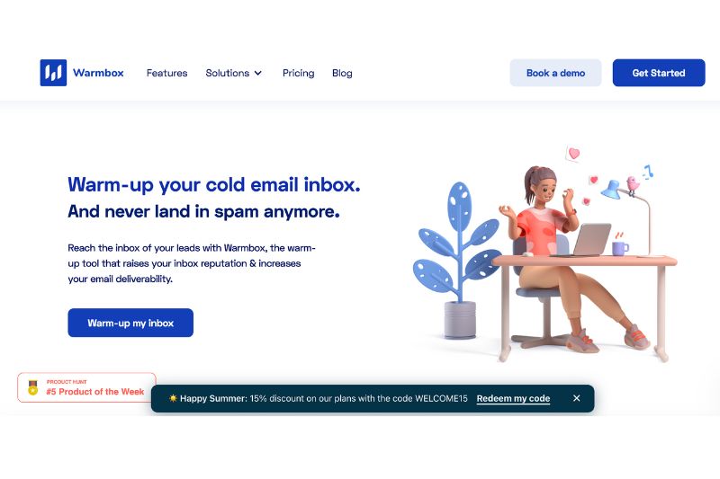 A woman sits at a desk using a laptop with floating email icons around her. The webpage promotes Warmbox, an email warmer and one of the best QuickMail Auto Warmer alternatives for effective cold email outreach.