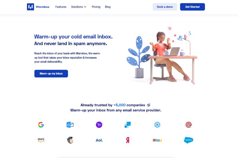 A woman sits at a desk using a laptop with flying email icons around her. Text promotes improved email deliverability and inbox warm-up for B2B companies, with logos of various email providers below.