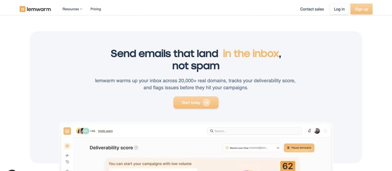 Lemwarm homepage with the headline Send emails that land in the inbox, not spam, and a deliverability score dashboard preview.